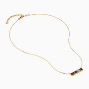 The Mosaic 14K Yellow Gold Multi Color Gemstone and Diamond Collar Bone Bar Necklace features a horizontal bar pendant set with five baguette-cut rainbow gemstones: red, purple, blue, green, and yellow.