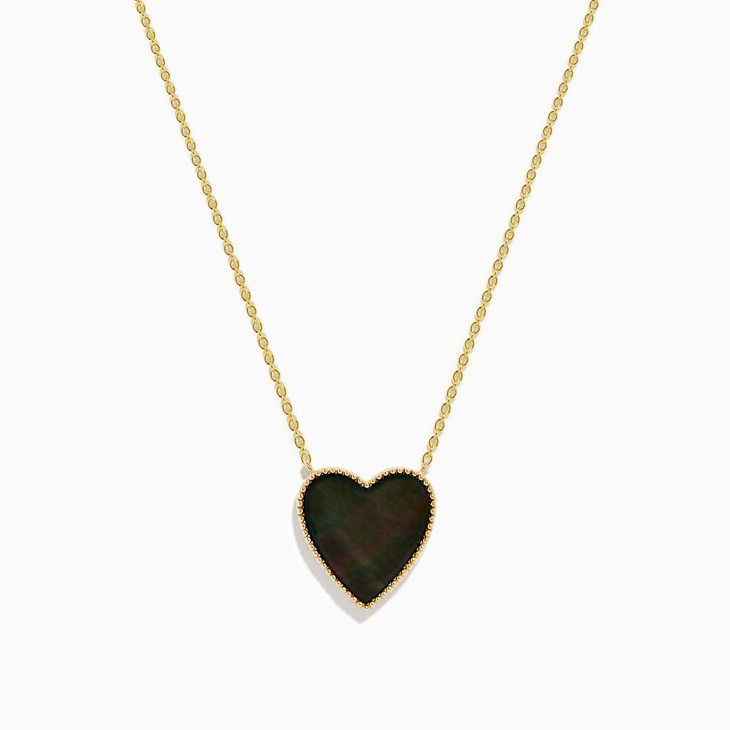 The 14K Gold Black Mother of Pearl and Diamond Reversible Heart Necklace features a heart-shaped black mother of pearl pendant bordered in gold.