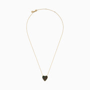 The 14K Gold Black Mother of Pearl and Diamond Reversible Heart Necklace features a heart-shaped black mother of pearl pendant bordered in gold.