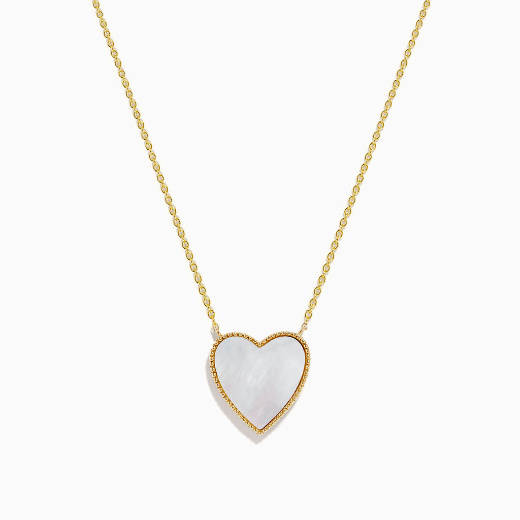 14K Gold Mother of Pearl and Diamond Reversible Heart Necklace featuring a large heart-shaped pendant with gold detailing, shown on a plain white background.