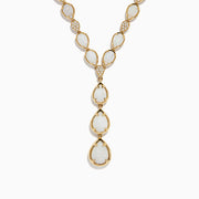 The Aurora 14K Yellow Gold Opal and Diamond Y Necklace showcases three pear-shaped opals in a vertical drop pendant, with small diamonds accenting some of the links between the opals.
