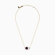 The 14K Yellow Gold Amethyst, White Topaz, and Diamond Necklace features two heart pendants: an amethyst surrounded by diamonds and a white topaz, both elegantly hanging side by side.