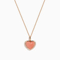 The 14K Rose Gold Pink Opal and Diamond Heart Pendant features a pink opal heart accented with sparkling diamonds on a rose gold chain.