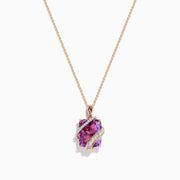 The 14K Rose Gold Pink Amethyst and Diamond Pendant features a large faceted pink amethyst wrapped in a wavy band of diamonds, suspended from a delicate rose gold chain against a white background.