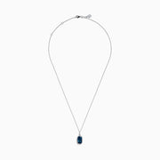 A 14 karat white gold necklace featuring an elongated cushion blue topaz and diamond pendant, set in an elegant frame.