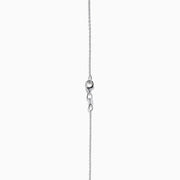 The Ocea Bleu 14K White Gold Blue Topaz and Diamond Pendant showcases a round blue topaz encircled by small diamonds, hanging from a delicate chain against a white background.