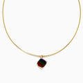 A 14K yellow gold snake chain pendant necklace featuring an ammolite and diamond, its multicolored gemstone showcased against a plain white background.