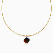 A 14K yellow gold snake chain pendant necklace featuring an ammolite and diamond, its multicolored gemstone showcased against a plain white background.