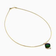 A 14K yellow gold snake chain pendant necklace featuring an ammolite and diamond, its multicolored gemstone showcased against a plain white background.