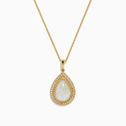 The 14K Yellow Gold Opal and Diamond Pear Shaped Pendant features a teardrop opal surrounded by two rows of sparkling diamonds on a yellow gold chain, shown against a white background.