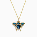 The Novelty 14K Yellow Gold Blue Topaz and Diamond Bee Pendant features a bee-shaped design with faceted blue topaz and diamond accents on its body and wings, shown against a white background.