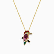 The 14K Yellow Gold Multi Gemstone and Diamond Woodpecker Pendant features a vibrant bird accented with diamonds and colorful gemstones, shining brightly on a fine gold chain against a white background.