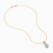 The Ocean Bleu 14K Yellow Gold Blue Topaz and Diamond Pear Pendant features a pear-shaped Blue Topaz accented with diamond swirls, set in 14K yellow gold and photographed on a plain white background.