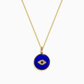 14K Yellow Gold Lapis and Diamond Evil Eye Disc Pendant features a gold chain and round pendant with a central evil eye design crafted from lapis and diamonds, set against a white background.
