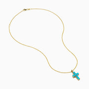 The 14K Yellow Gold Turquoise and Diamond Cross Pendant features a turquoise cross accented with sparkling diamonds for an elegant touch.
