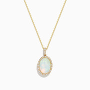 The 14K Yellow Gold Opal and Diamond Pendant features a delicate yellow gold chain with an oval opal center, accented by a halo of sparkling diamonds.