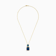 The 14K Yellow Gold London Blue Topaz and Diamond Pendant features two rectangular topaz stones—one accented with diamonds—suspended vertically from a fine gold chain.