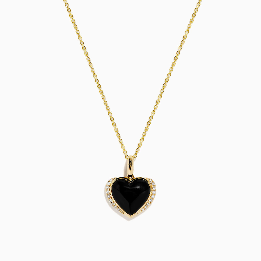 The 14K Yellow Gold Onyx and Diamond Heart Pendant features a glossy black onyx center surrounded by sparkling diamonds, all set on a yellow gold chain necklace.