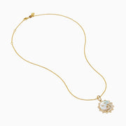 The Seaside 14K Yellow Gold Mother Of Pearl and Diamond Bird and Sea Pendant features a sun-inspired design with bird silhouettes, wave accents with diamonds, a mother-of-pearl background, and a delicate gold chain.