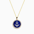 The Seaside 14K Yellow Gold Lapis and Diamond Anchor Pendant showcases a round lapis centerpiece with a diamond anchor motif on deep blue, bordered by sparkling diamonds and suspended from a yellow gold chain.