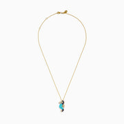 This 14K Yellow Gold necklace features a Seahorse Pendant adorned with turquoise, sapphire, tsavorite, and diamond gemstones on a delicate chain.