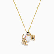 The 14K Yellow Gold Freshwater Pearl, Pink Sapphire and Diamond Crab Pendant features a charming crab with a freshwater pearl body, pink sapphire eyes, and diamond accents on a delicate chain.
