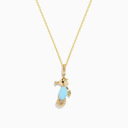 The Seaside 14K Yellow Gold Turquoise and Diamond Seahorse Pendant features a seahorse with a turquoise stone body and diamond accents on the tail, hanging from a delicate gold chain.