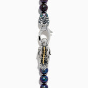The 925 Sterling Silver & 18K Gold Gray Freshwater Pearl Necklace features a silver dragon clasp with gold accents, displayed on a plain white background.
