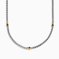 The Mens 925 Sterling Silver Black Spinel Necklace features three evenly spaced gold settings with small round black gemstones for a simple, elegant look.