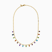 The 14K Yellow Gold Multi-Gemstone Paperclip Chain Fringe Necklace features vibrant gemstones in assorted shapes and sizes along a paperclip chain, beautifully displayed on a white background.