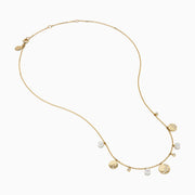 The 14K Yellow Gold Pearl and Diamond Necklace features small round charms and lustrous pearls, with some charms adorned with sparkling diamonds, creating an elegant and delicate design against a white background.