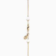 The Mosaic 14K Yellow Multi Color Gemstone and Fresh Water Pearl Station Necklace features evenly spaced blue, orange, and green gemstones with fresh water pearls on a gold chain, displayed on a white background.