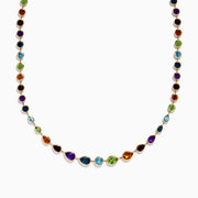 The Mosaic 14K Yellow Gold Multi Gemstone Necklace showcases small round and teardrop-shaped gems set on a gold chain, displayed against a white background.
