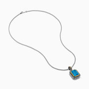 The Ocean Bleu 925 Sterling Silver and 18K Yellow Gold Blue Topaz Pendant features a rectangular faceted blue topaz framed by twisted silver and yellow gold accents on a sterling silver chain.