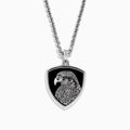 The Mens 925 Sterling Silver Onyx Pendant features a detailed engraved eagle head on a black shield-shaped background, crafted from sterling silver and suspended from a sleek silver chain.