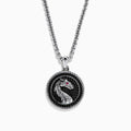 The Mens 925 Sterling Silver Black Spinel and Ruby Pendant features a round dragon design on a textured black background, with a small ruby as the dragons eye, suspended from a sterling silver chain necklace.