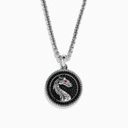 The Mens 925 Sterling Silver Black Spinel and Ruby Pendant features a round dragon design on a textured black background, with a small ruby as the dragons eye, suspended from a sterling silver chain necklace.