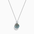 The 14K White Gold Tahitian Pearl and Diamond Pendant showcases a round Tahitian pearl with three sparkling diamonds above it, all set in lustrous white gold and displayed against a plain white background.