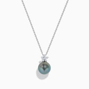 The 14K White Gold Tahitian Pearl and Diamond Pendant showcases a round Tahitian pearl with three sparkling diamonds above it, all set in lustrous white gold and displayed against a plain white background.