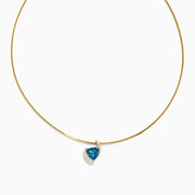 The Ocean Bleu 14K Yellow Gold Collar Necklace features a teardrop London Blue Topaz pendant surrounded by small white stones, beautifully displayed against a white background.