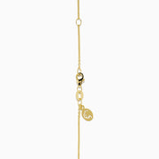 The 14K Yellow Gold Garnet and Diamond Pendant features a four-petal flower-shaped garnet with deep red gemstones outlined in yellow gold and a small clear diamond at the center, shown on a white background.