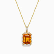 The Sunset 14K Yellow Gold Citrine and Diamond Halo Pendant showcases a rectangular citrine surrounded by sparkling diamonds, set in 14K yellow gold and displayed on a white background.