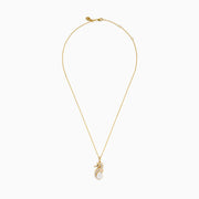 The Novelty 14K Yellow Gold Sea Horse Pendant features white and black diamonds along the body, a round pearl at the tail, and hangs elegantly from a gold chain on a white background.