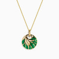 The 14K Yellow Gold Malachite and Diamond Inlay Pendant features a circular malachite centerpiece with gold accents and small diamonds, hanging from a delicate gold chain.