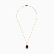 The 14K Yellow Gold Ammolite and Diamond Pendant features an oval red-green ammolite surrounded by clear diamonds on a delicate chain, elegantly displayed against a white background.