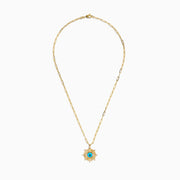 The 14K Yellow Gold Turquoise and Diamond Evil Eye Pendant features a sunburst design with a vivid blue and black evil eye center, accented by sparkling diamonds along the edges.