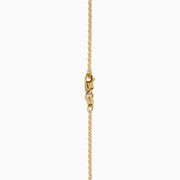 The 14K Yellow Gold London Blue Topaz and Diamond Double Halo Pendant features an oval London Blue Topaz and sparkling white diamonds, set on a gold chain necklace.