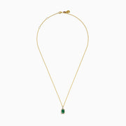 The Brasilica 18K Yellow Gold Emerald and Diamond Pendant features an emerald-cut green gemstone surrounded by small diamonds, showcased on a chain against a plain white background.