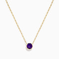 The 14K Yellow Gold Amethyst Bezel Paperclip Chain Pendant features a round, faceted amethyst set in a minimalist bezel on a delicate paperclip chain.