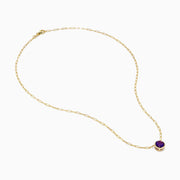 The 14K Yellow Gold Amethyst Bezel Paperclip Chain Pendant features a round, faceted amethyst set in a minimalist bezel on a delicate paperclip chain.